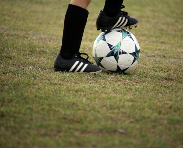person playing soccer on field