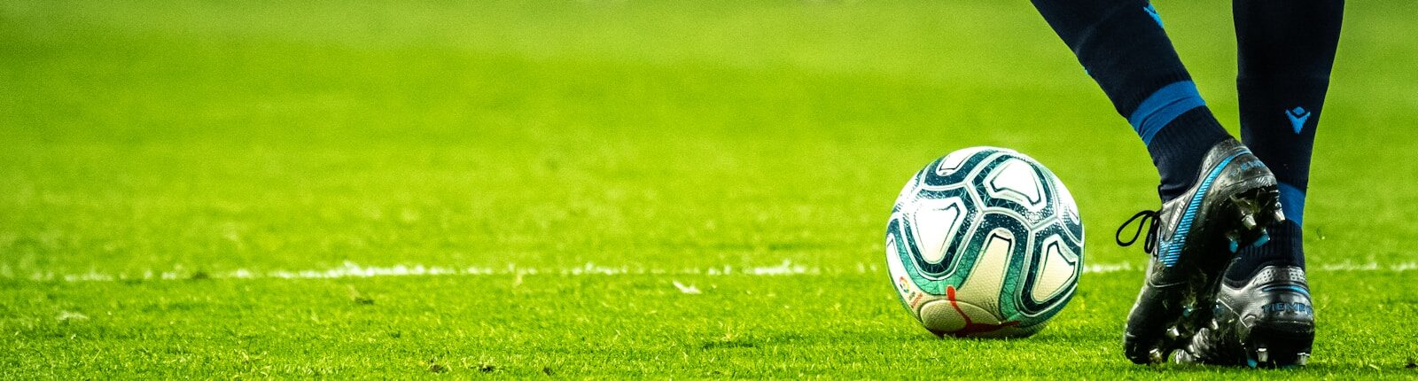 man playing soccer game on field