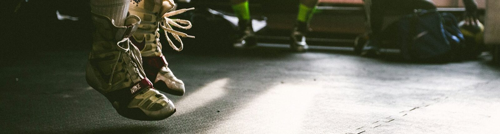 person wearing brown-and-white shoes jumping